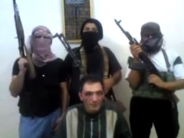 Hassan al-Mikdad in the custody of the Free Syrian Army Hassan al-Mikdad in the custody of the Free Syrian Army