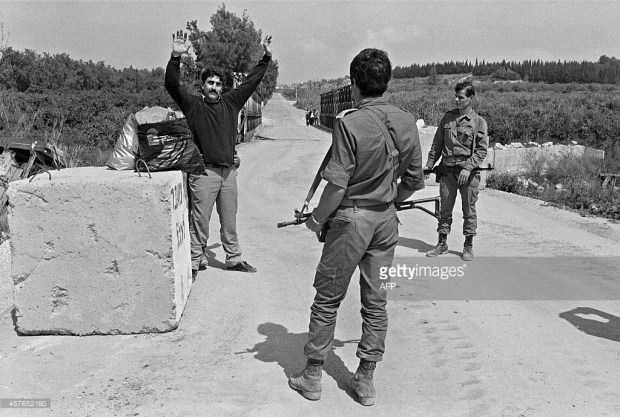  Israeli Defense Force (IDF) soldiers control 19 March 1985 a Shiite civilian at Kasmyah bridge after IDF evacuated in February about 500 sq km around Sidon (Saida), to the Litani river area, near Nabatiyah